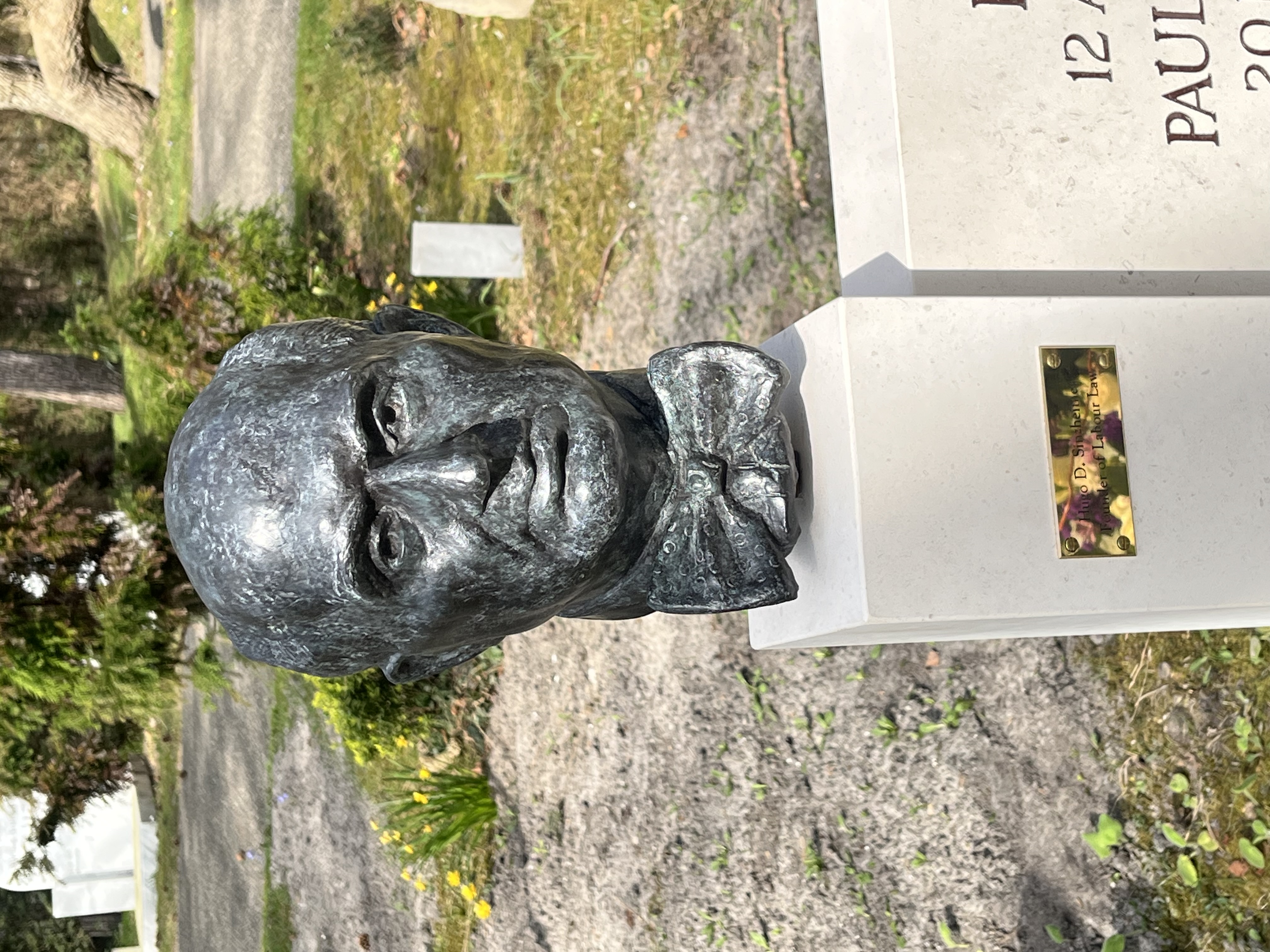 tomb,gravestone,face,head,person,adult,male,man,portrait,art