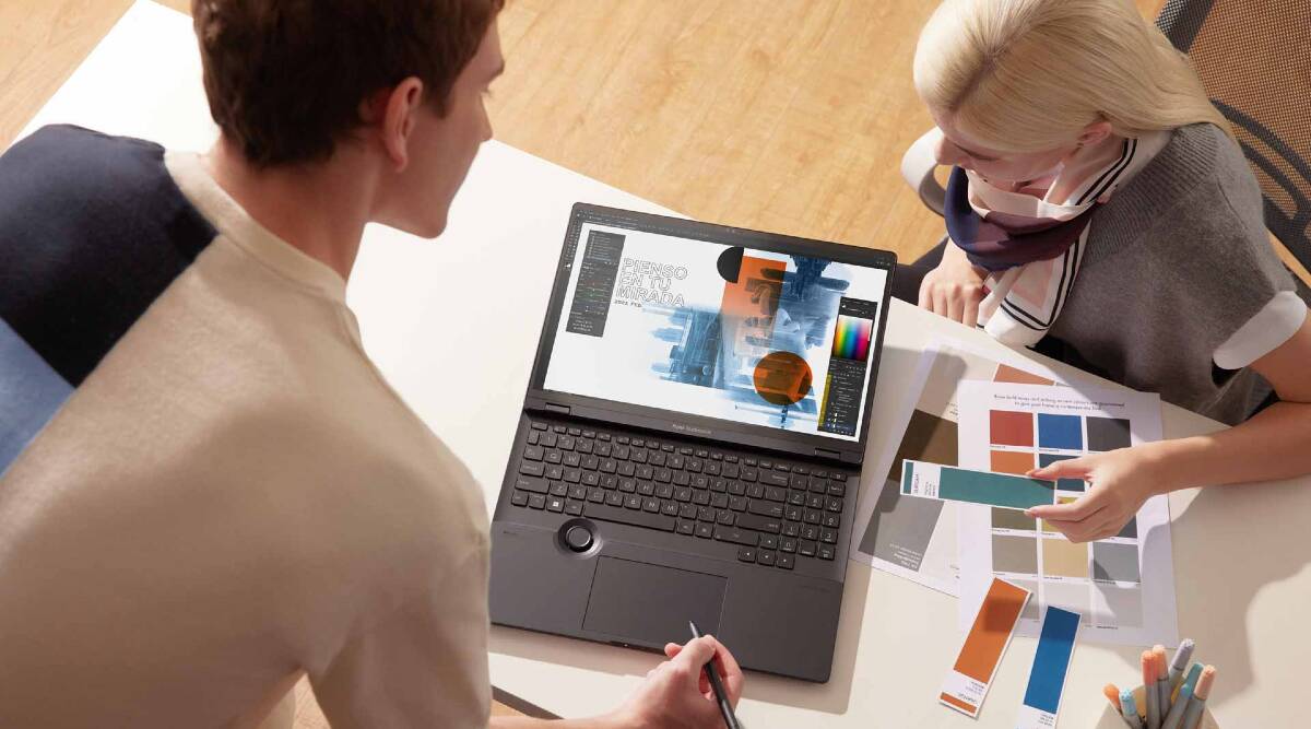 person,woman,adult,female,laptop,computer keyboard,head,pen,face,credit card