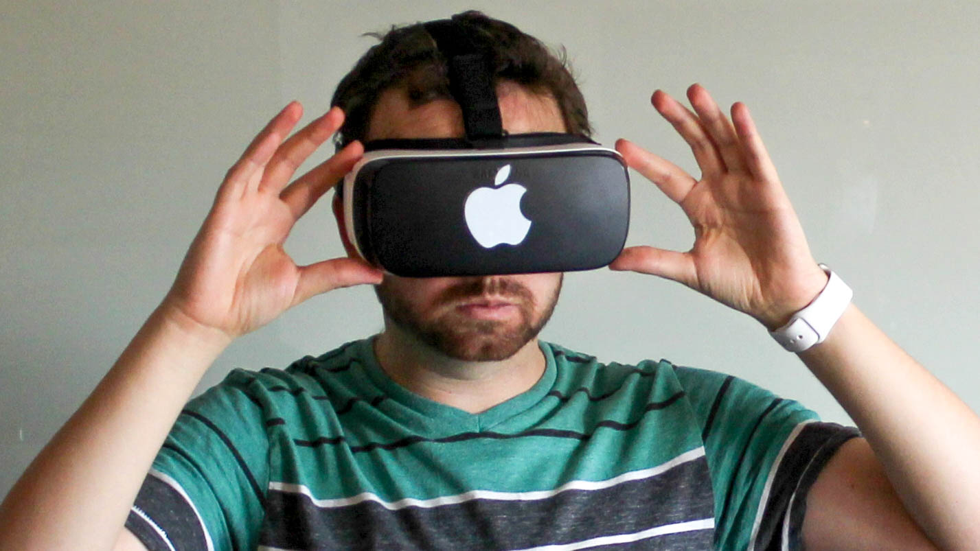 photography,face,head,vr headset,electronics,portrait,phone,mobile phone,t-shirt,finger