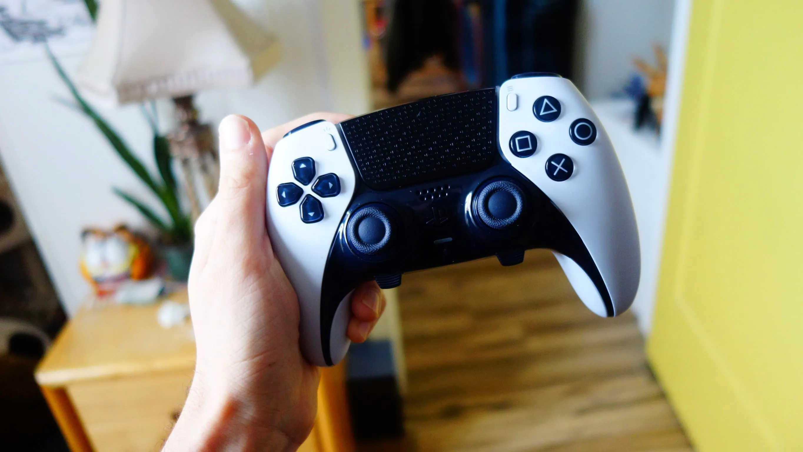 dualsense-edge-controller-in-hand.webp