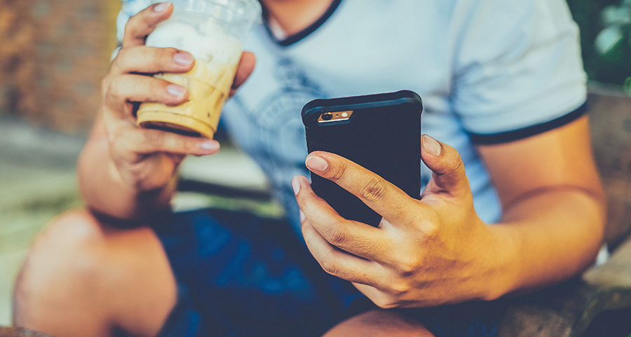 photography,electronics,mobile phone,phone,finger,person,shorts,texting,can,face