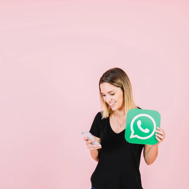 happy-woman-with-whatsapp-icon-using-cellphone_23-2147842241.webp