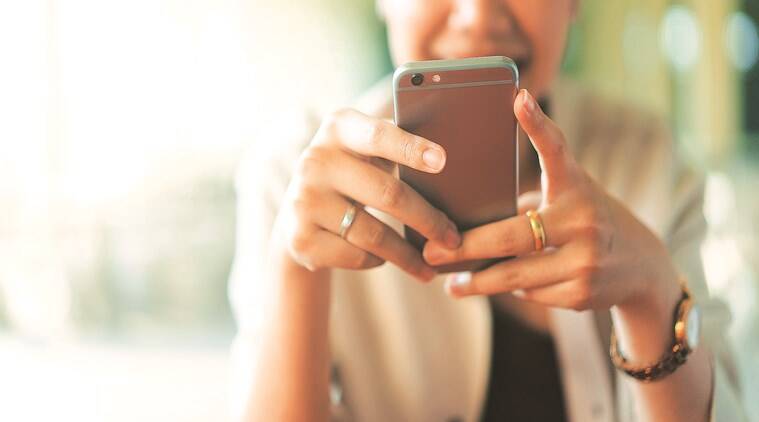 photography,electronics,mobile phone,phone,texting,face,head,person,iphone,credit card