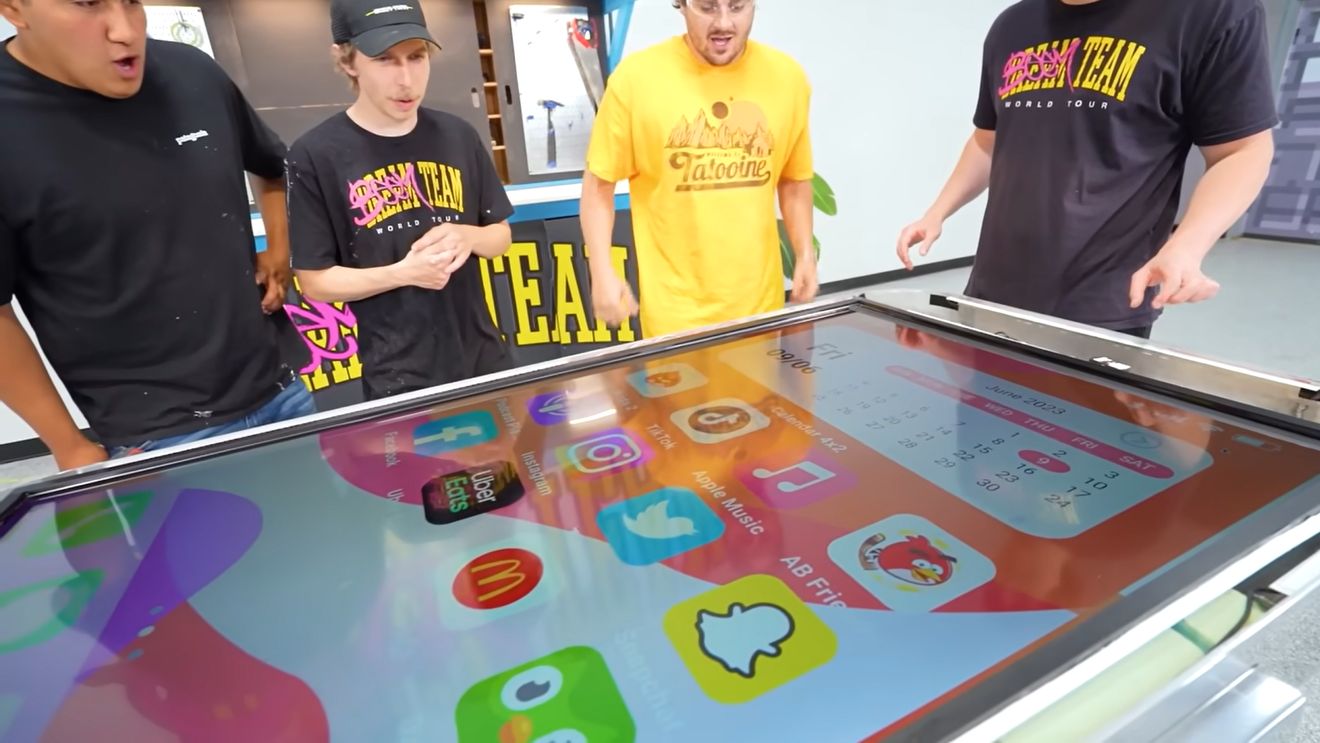 t-shirt,boy,male,person,teen,adult,man,computer,electronics,tablet computer