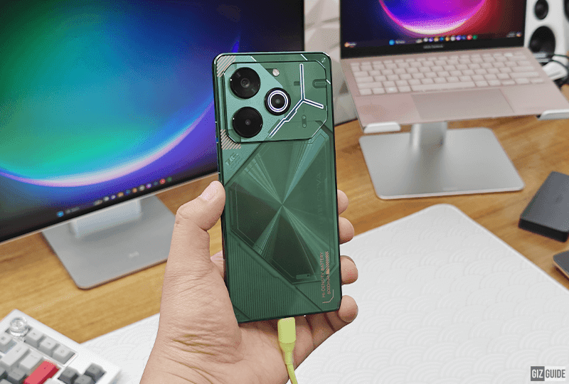 electronics,mobile phone,phone,computer,laptop,computer hardware,computer keyboard,person,monitor,speaker