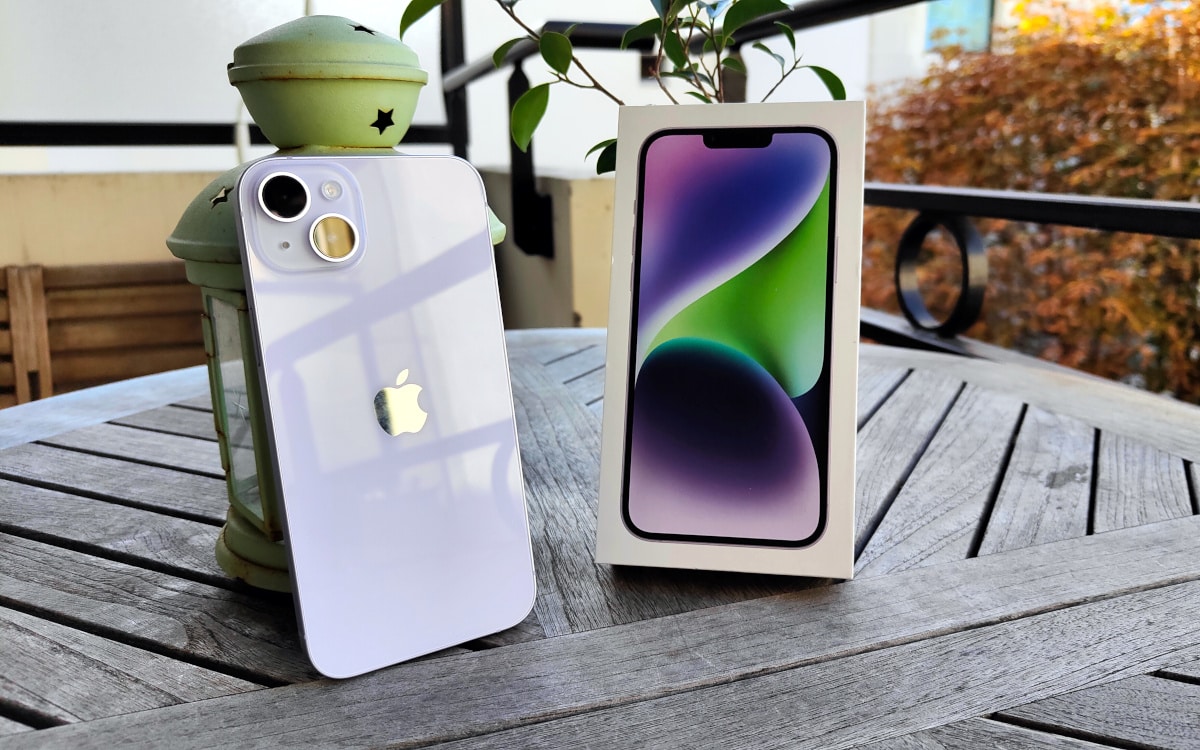 electronics,phone,mobile phone,desk,table,iphone,tablet computer,plant,chair,tin