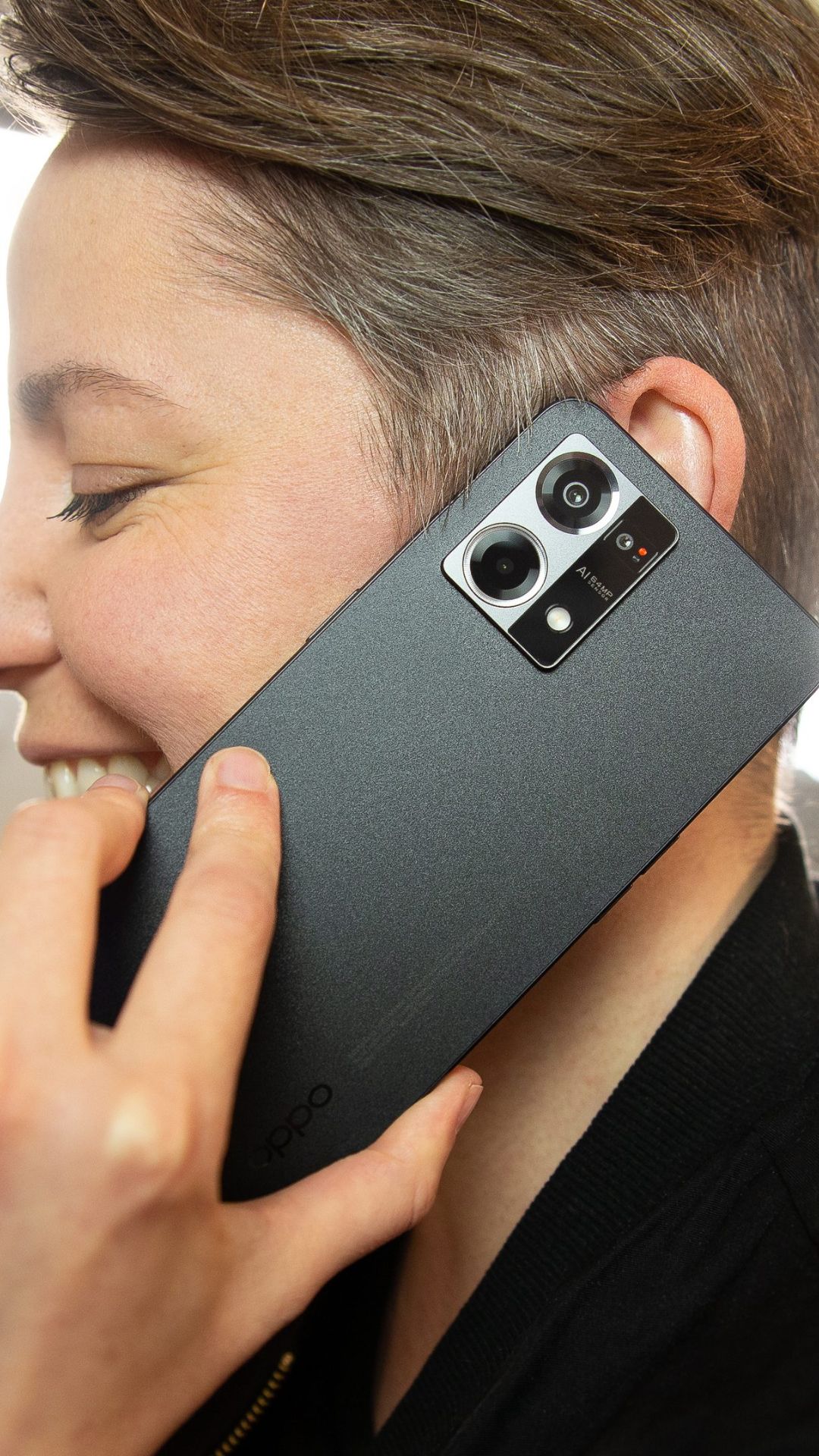 photography,adult,female,person,woman,electronics,mobile phone,phone,head,face