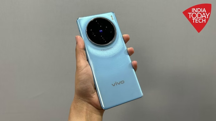 electronics,mobile phone,phone,camera,person,webcam,video camera,speaker