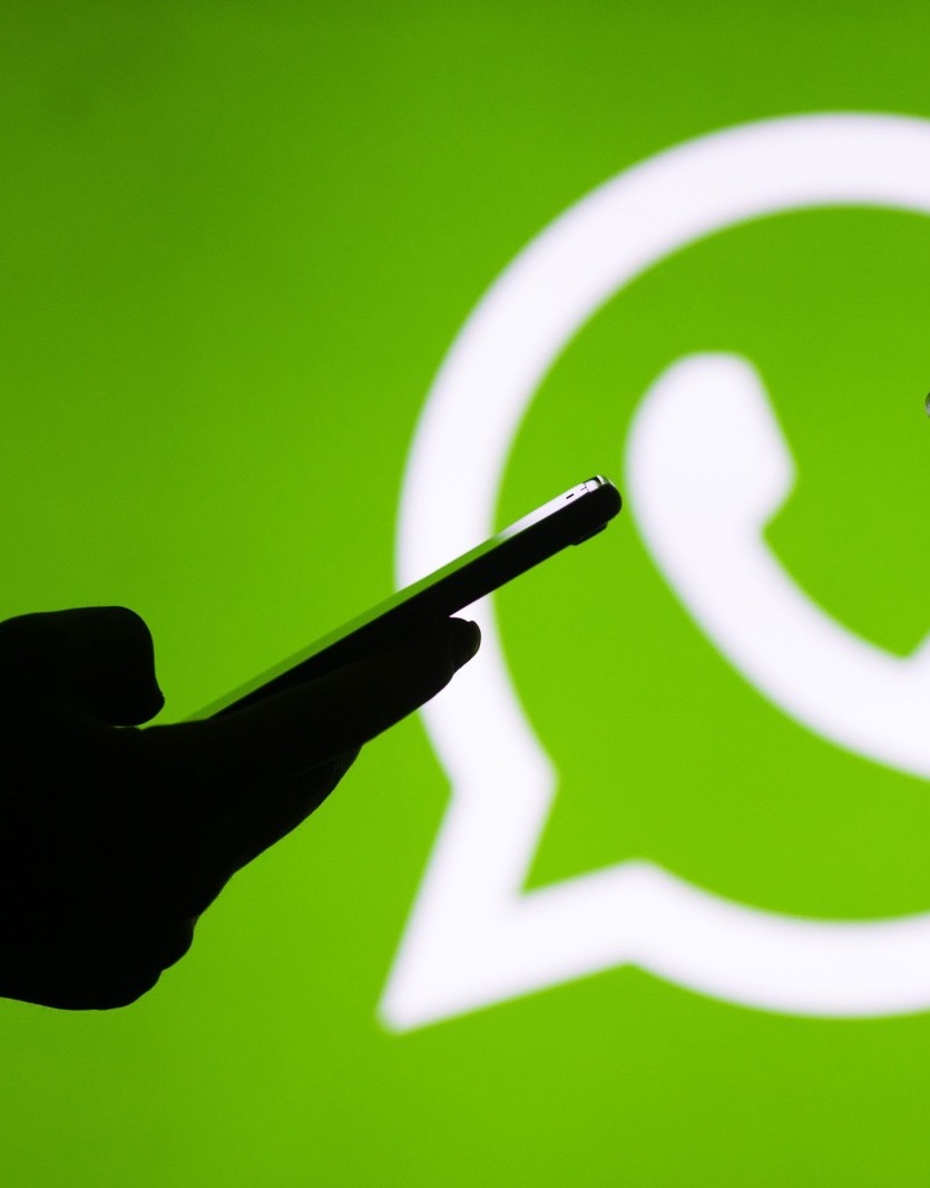 green,electronics,mobile phone,phone,body part,finger,hand,person,silhouette