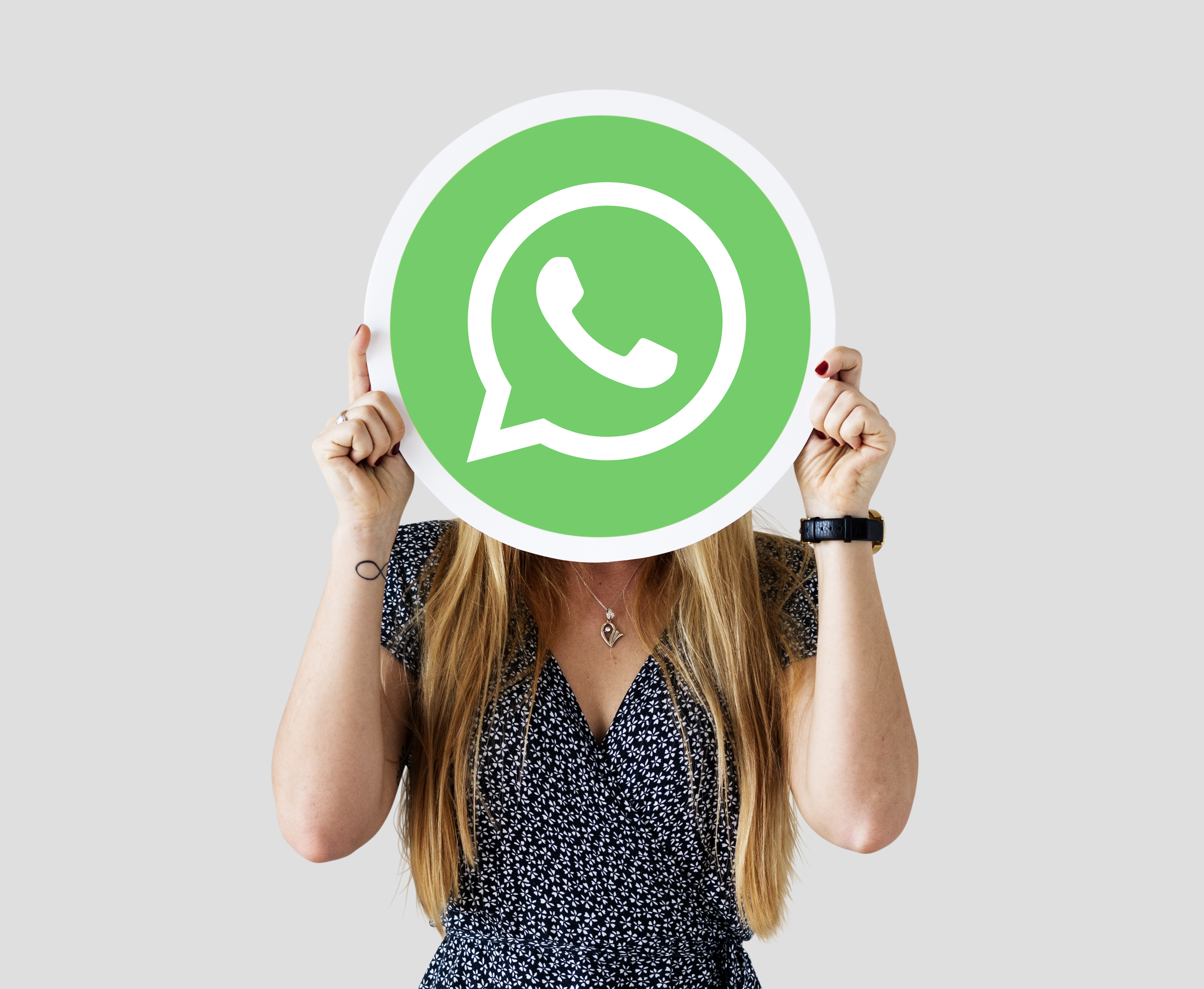 woman-showing-whatsapp-messenger-icon.jpg