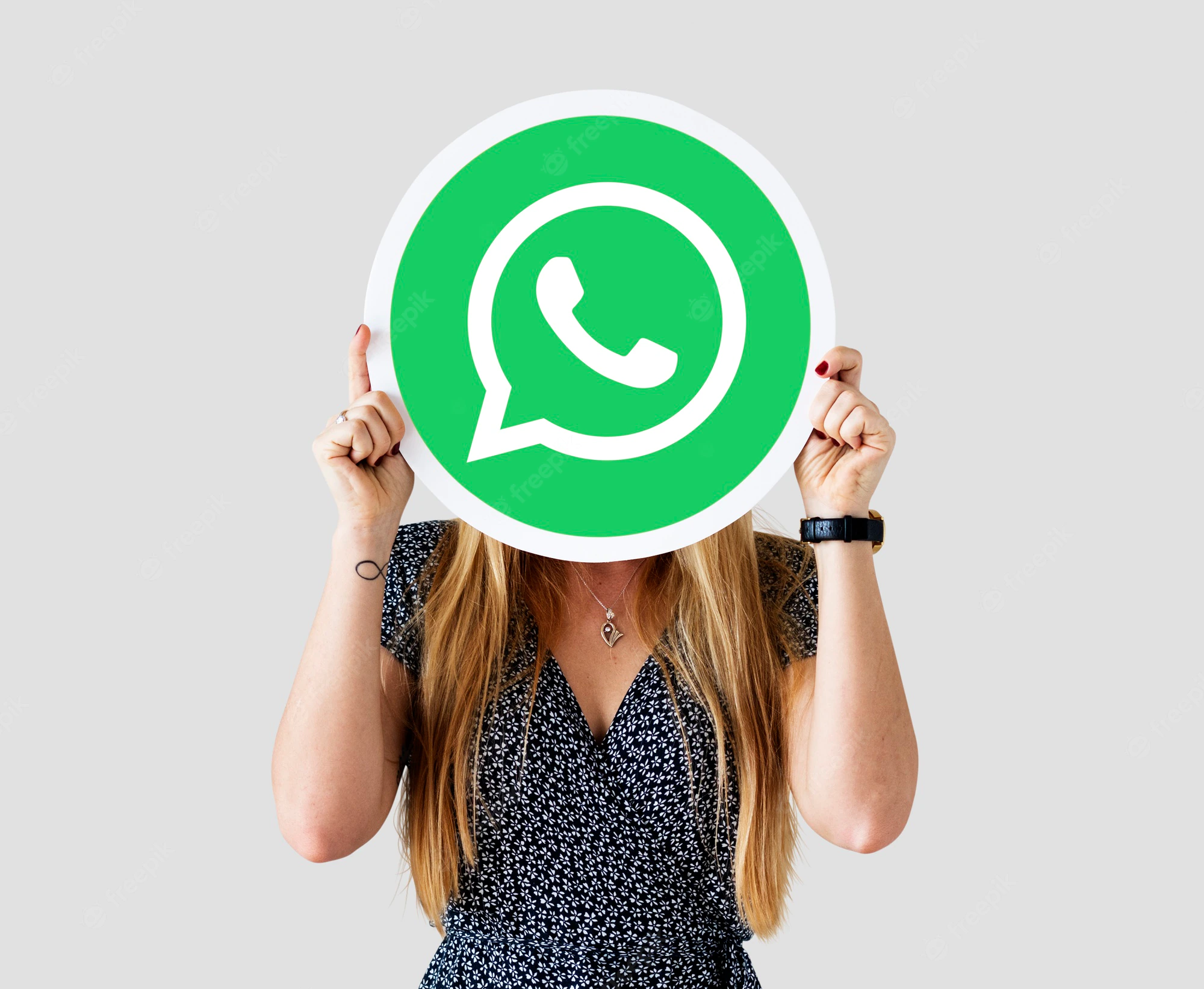 woman-showing-whatsapp-messenger-icon_53876-41312.webp