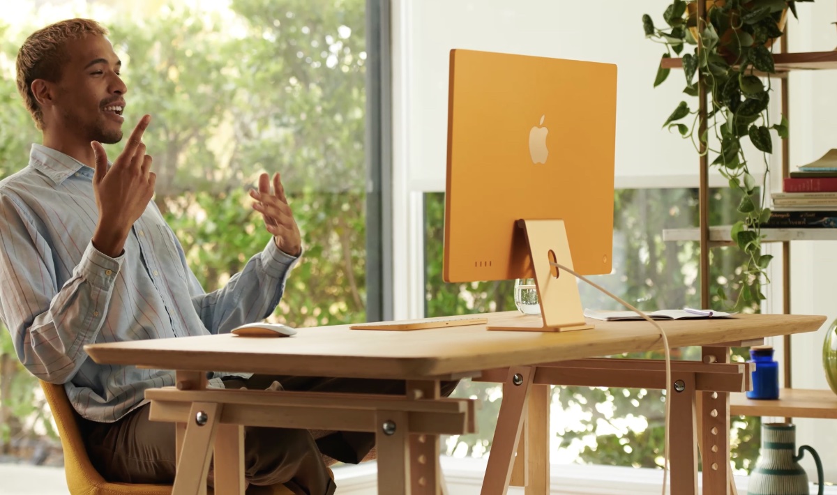furniture,table,adult,male,man,person,conversation,face,plant,desk