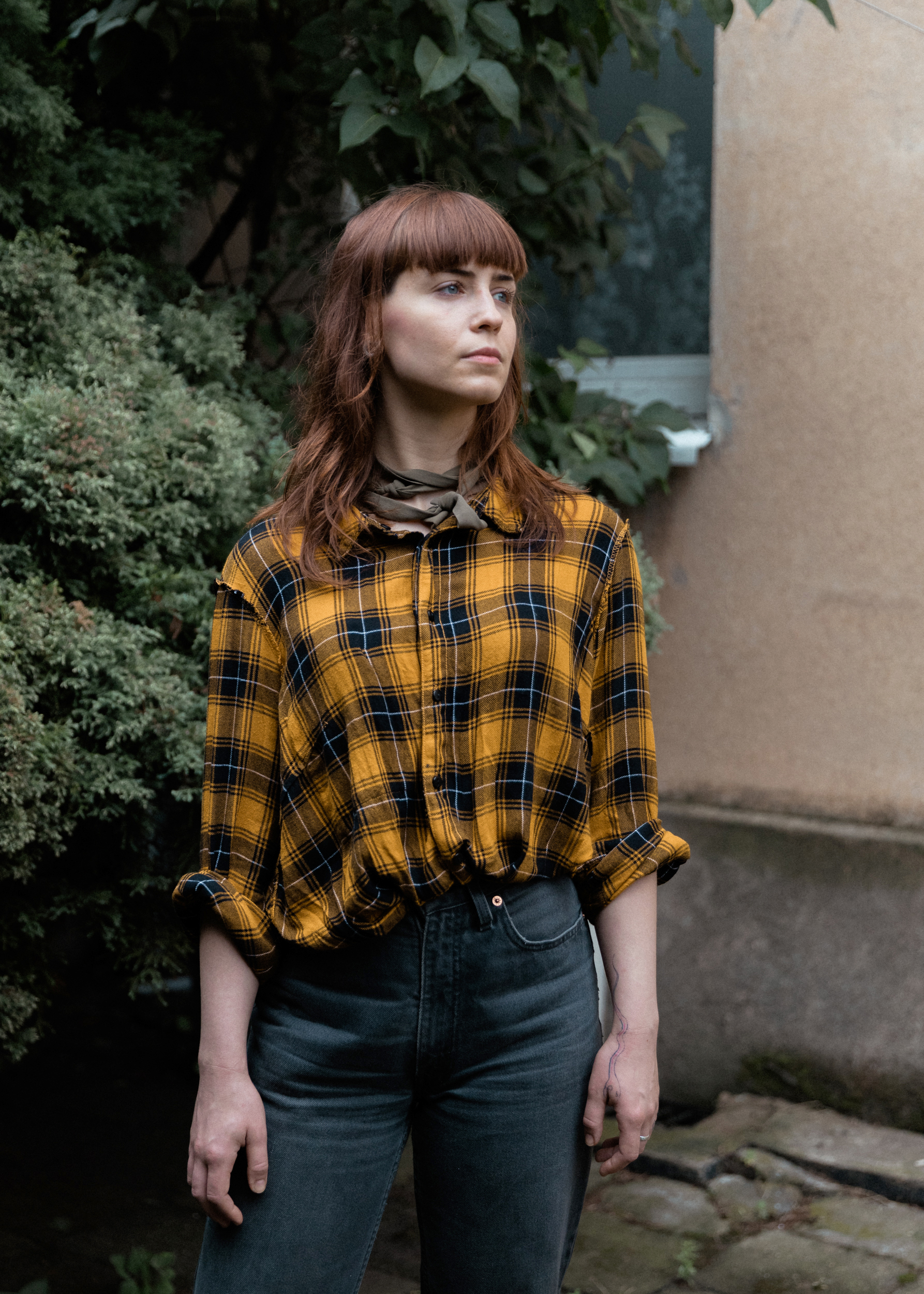 blouse,pants,shirt,person,woman,adult,female,ring,jeans,face
