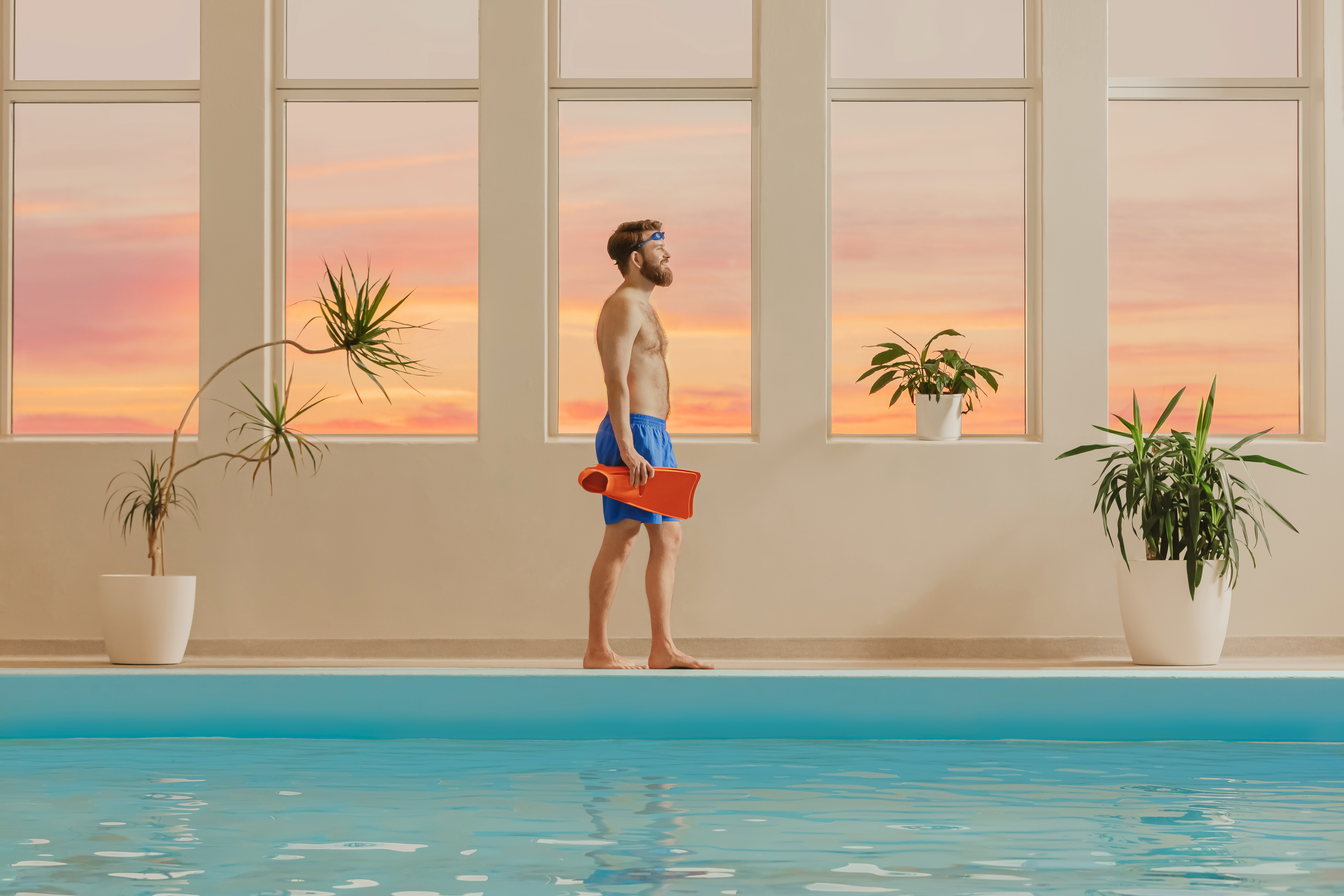 plant,potted plant,planter,vase,pool,water,person,swimming pool,swimwear,standing