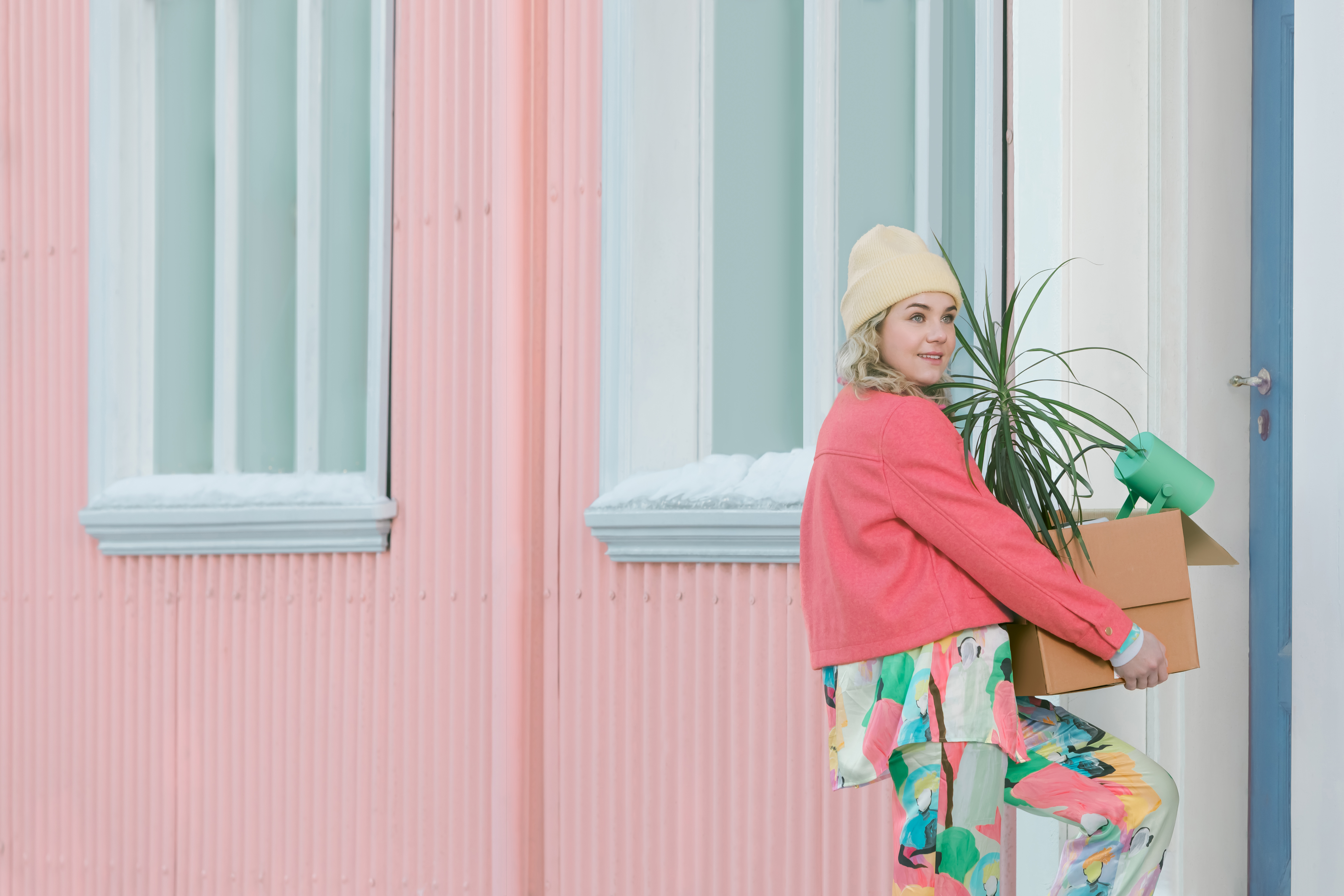 hat,box,child,female,girl,person,window,carton,cap,windowsill