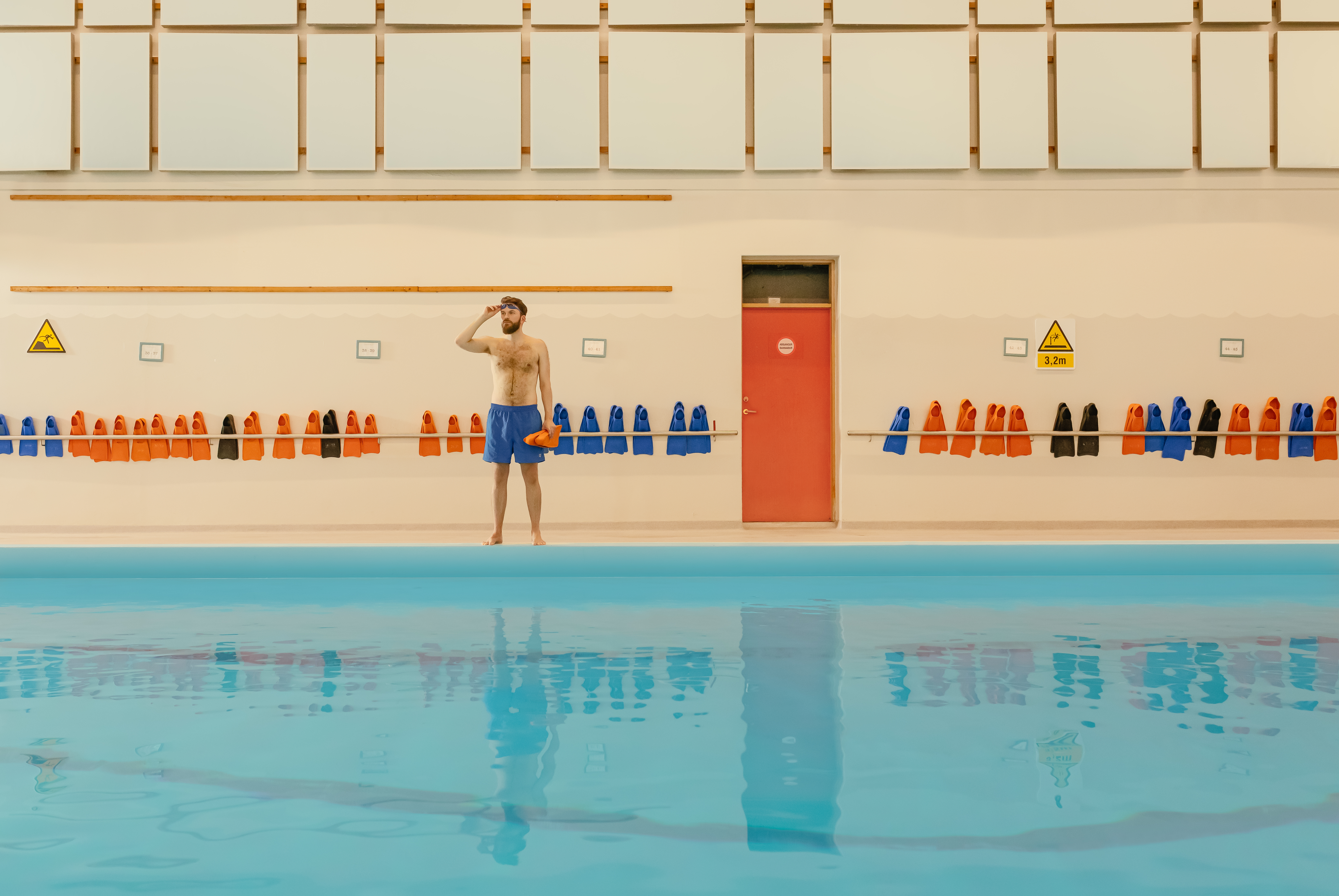 pool,water,person,swimming pool,hotel,resort,swimming,shorts,glasses,swimwear