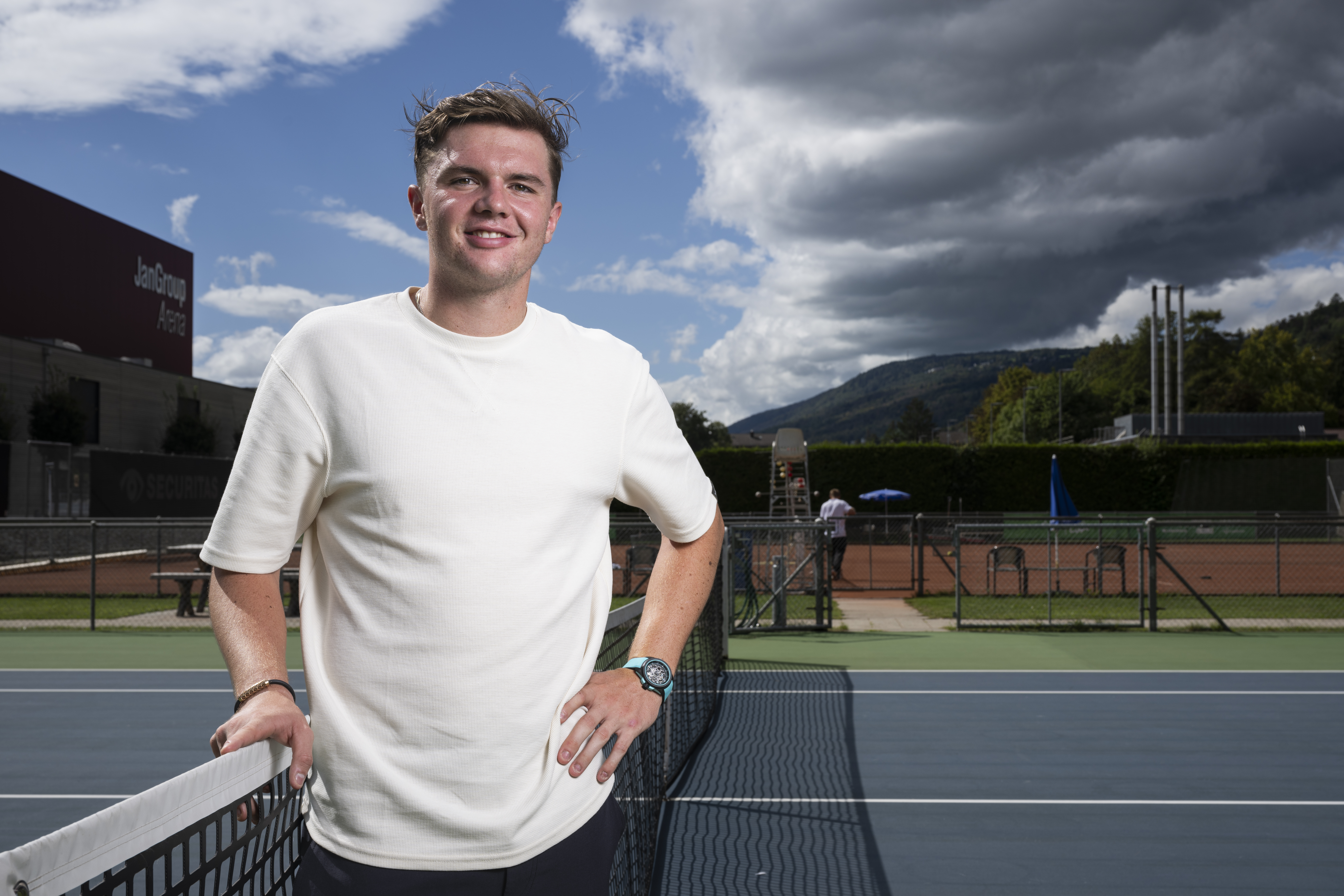 t-shirt,adult,male,man,person,finger,wristwatch,long sleeve,ring,bracelet