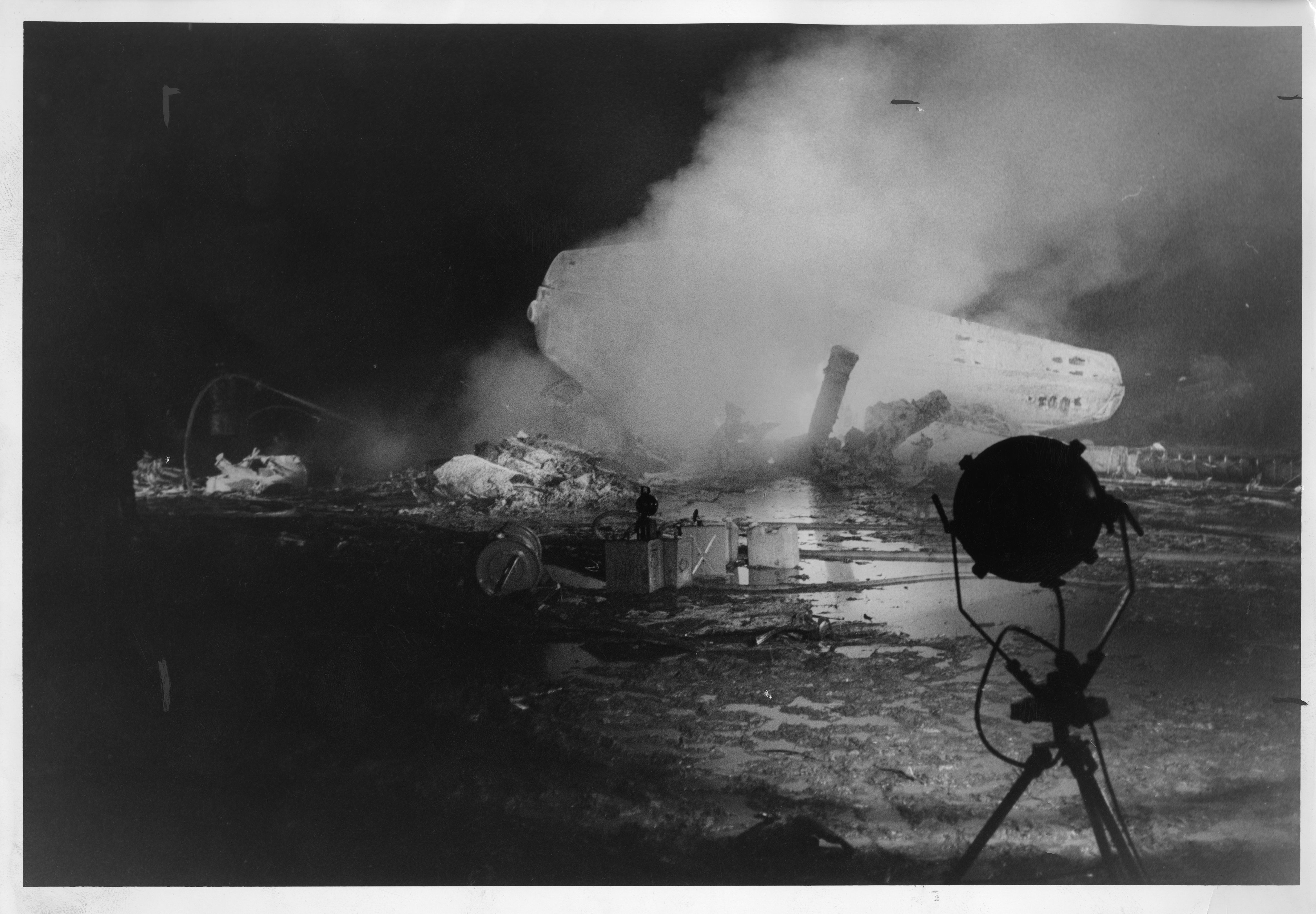 person,aircraft,airplane,transportation,vehicle,smoke,tripod,fire,pollution