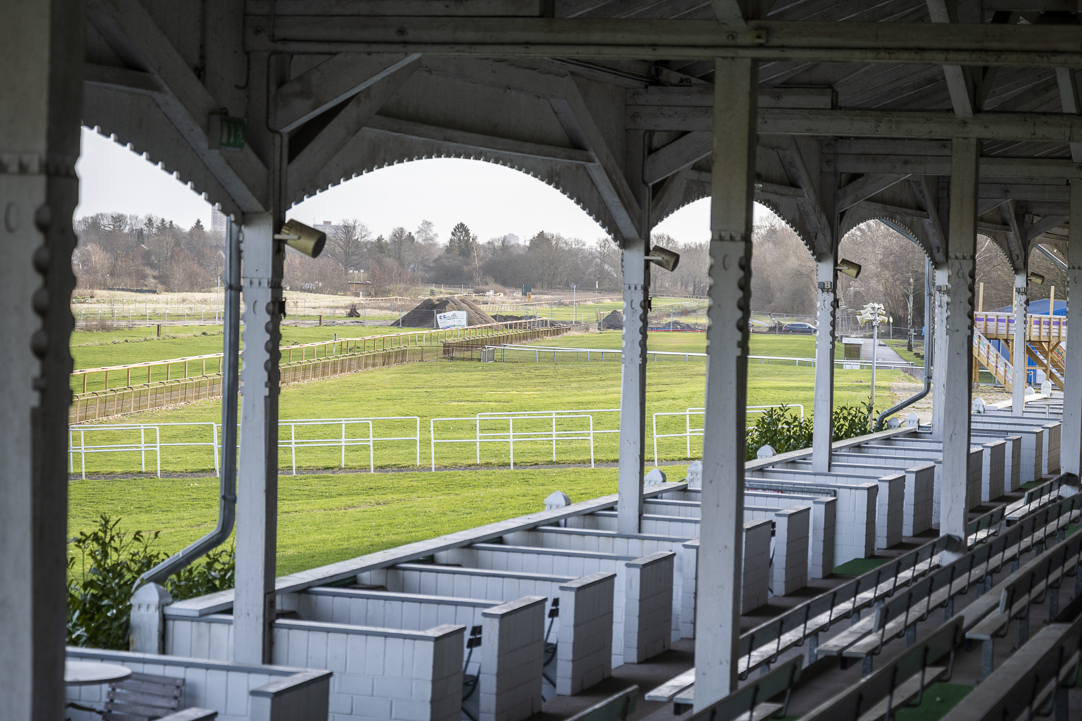 outdoors,building,porch,car,desk,grass,bench,field,person,nature