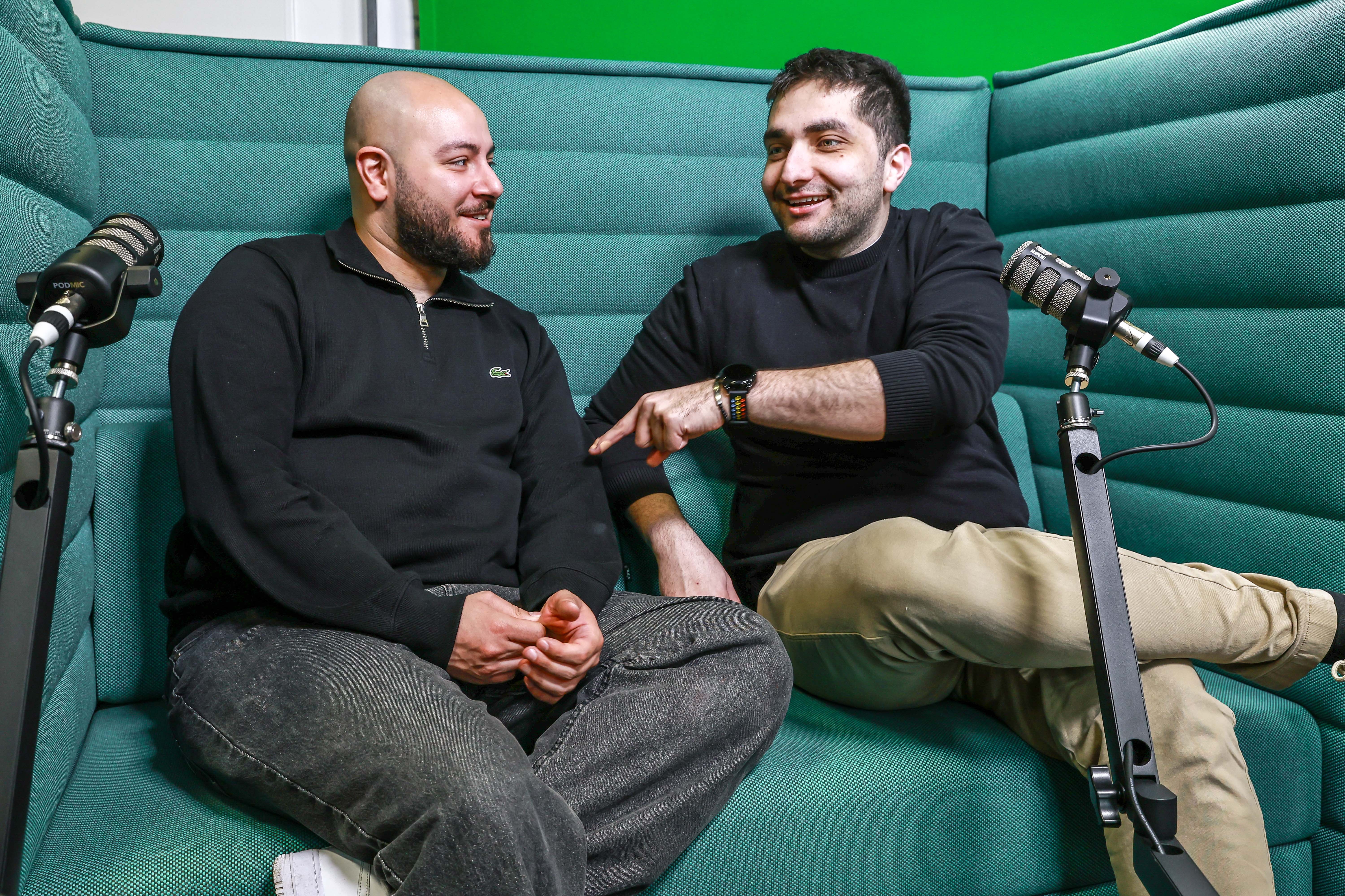 microphone,adult,male,man,person,conversation,couch,wristwatch,interview,face