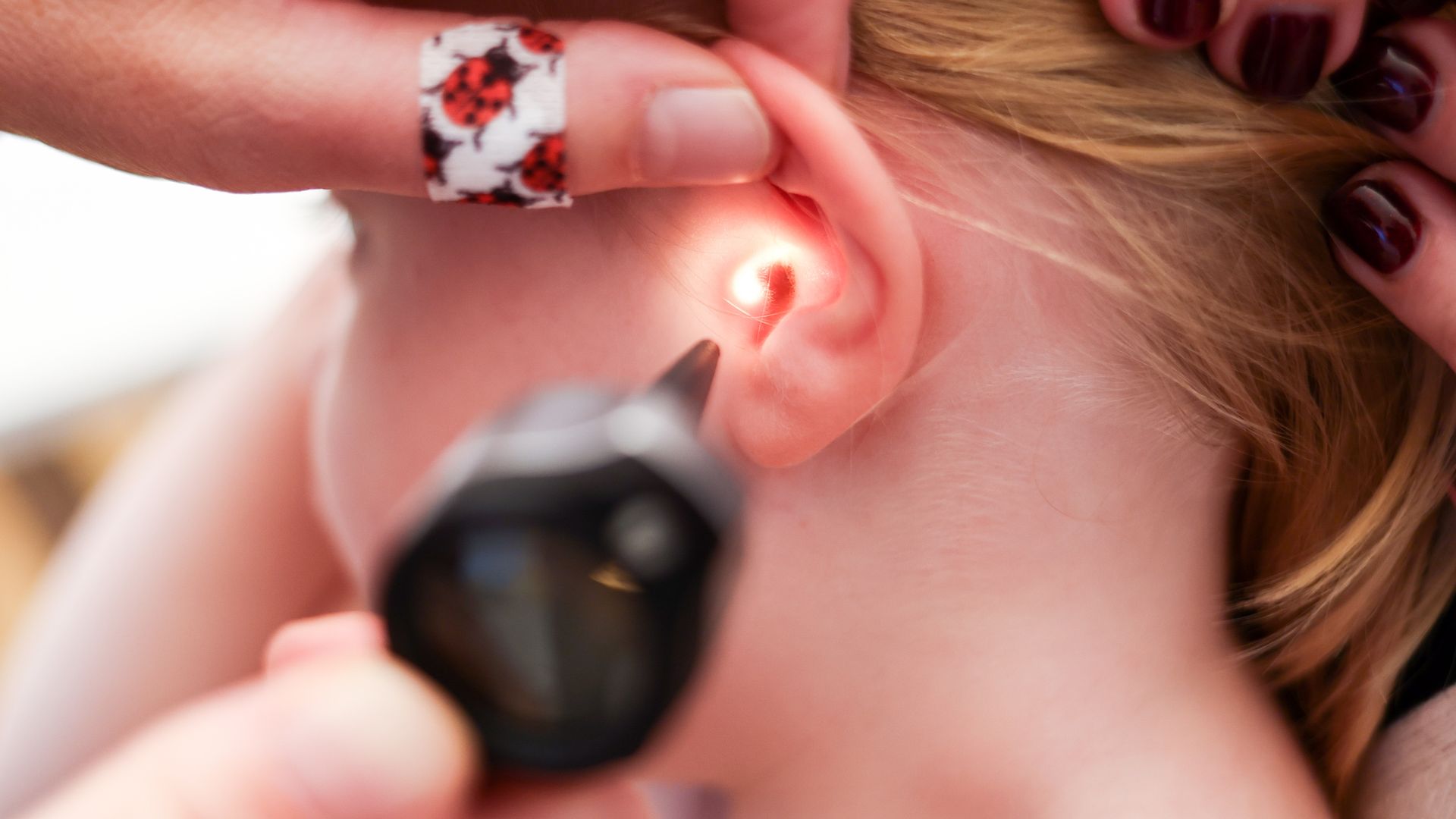 finger,hand,person,ear,nail,tape,accessories,jewelry,baby,head